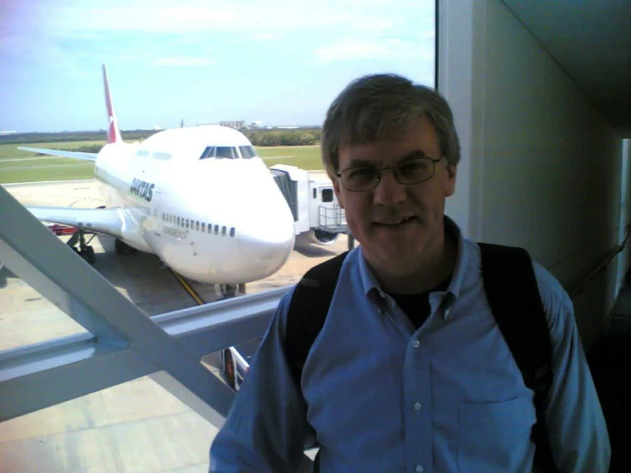 Paul Hughes at the airport getting ready to go on an overseas consulting assignment