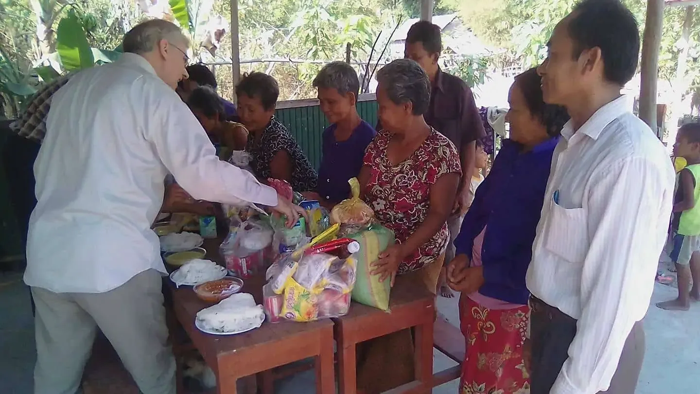Giving food to some of the elderly in Kampong Chhnang Province in Cambodia