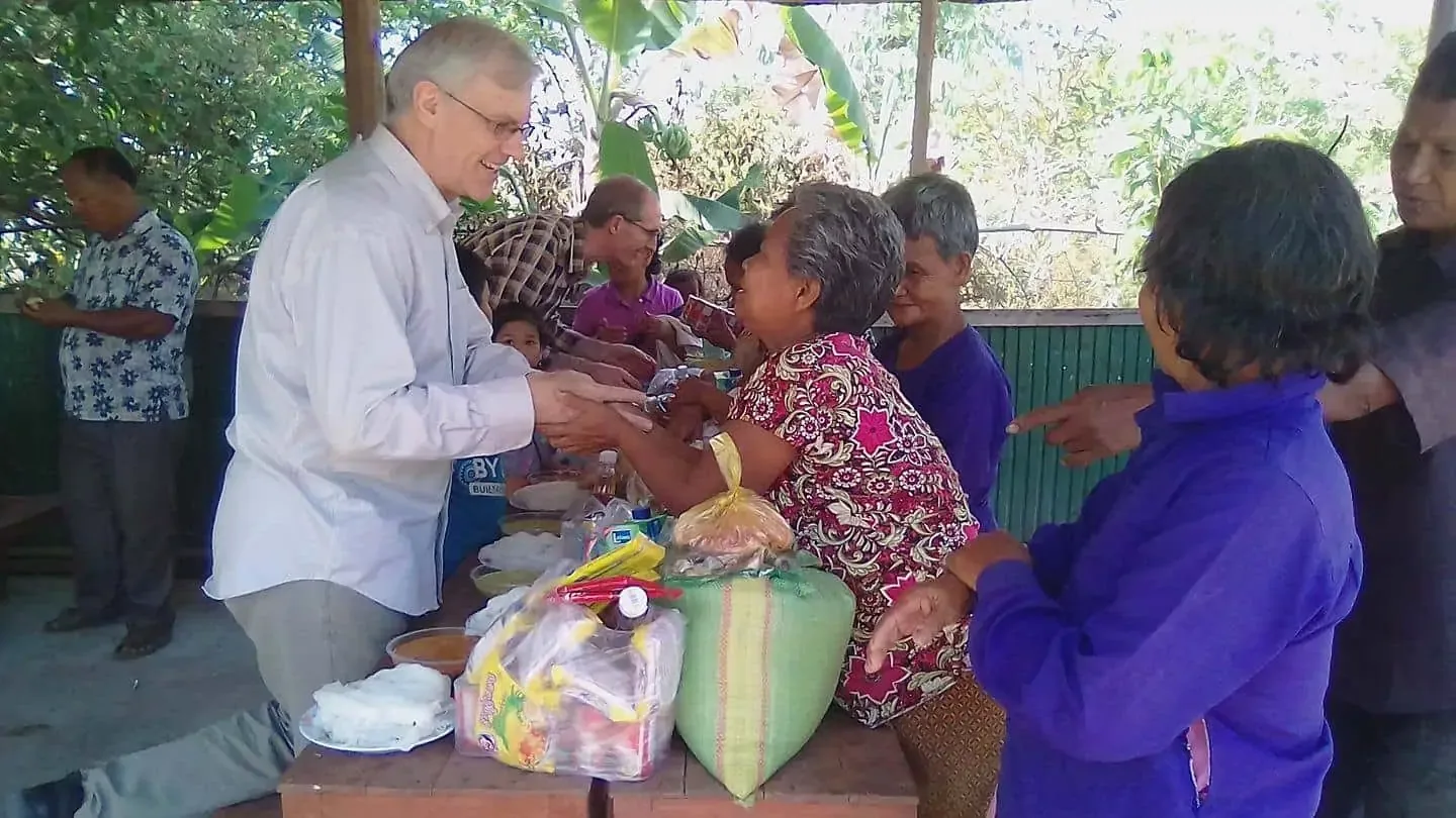 Giving food to some of the elderly in Kampong Chhnang Province in Cambodia