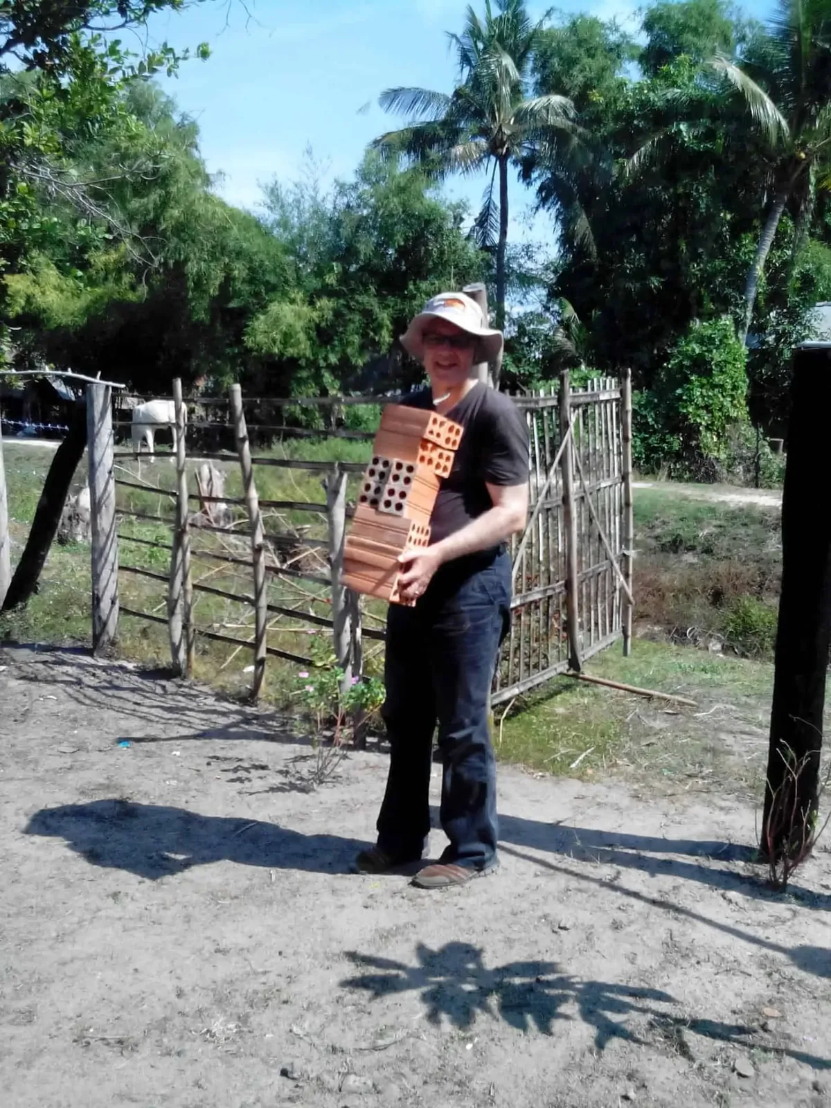 Paul Hughes helping to build a house, with other volunteers, at the New Day New Life Community Centre in Kampong Chhnang Province in Cambodia