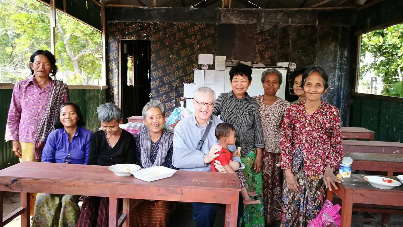 Paul Hughes meeting with some of the elderly at the New Day New Life Community Centre in Kampong Chhnang Province in Cambodia