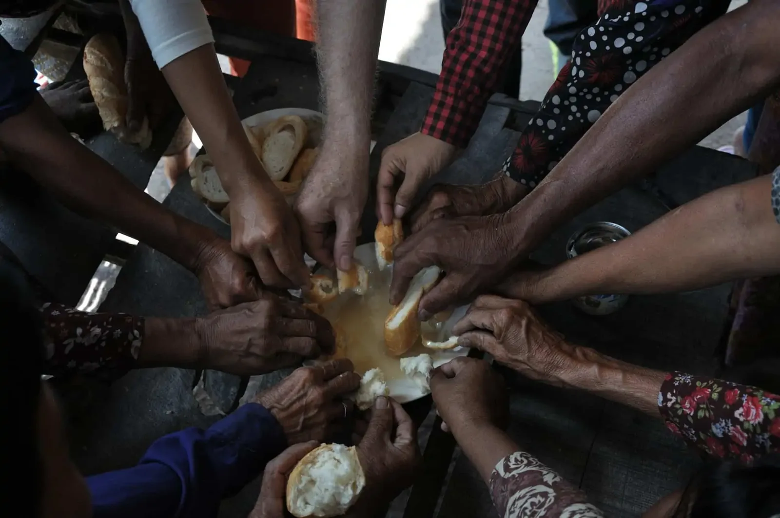 Paul sharing a meal with the elderly and other volunteers at the New Day New Life Community Centre in Kampong Chhnang Province in Cambodia
